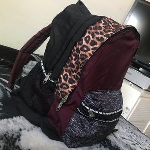 Burgundy and leopard print backpack.